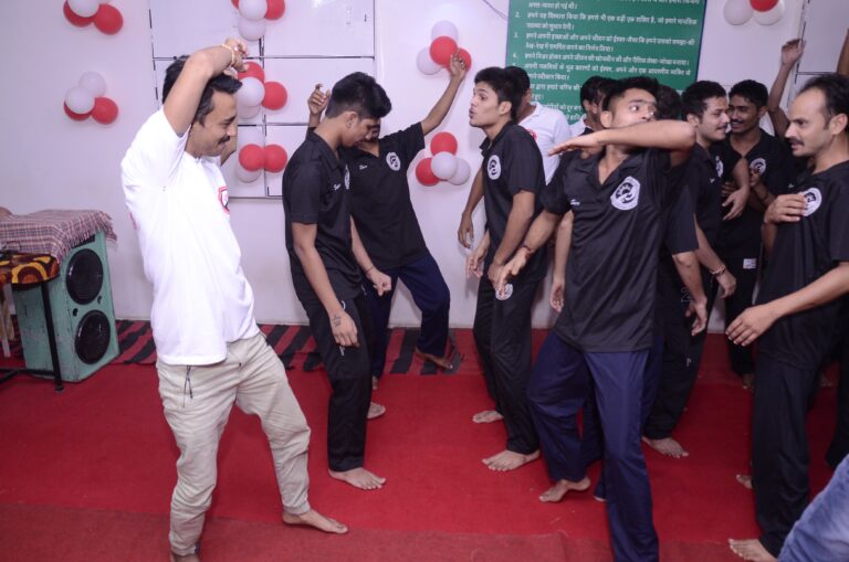 Residents dancing at rehabilitation centre gathering.